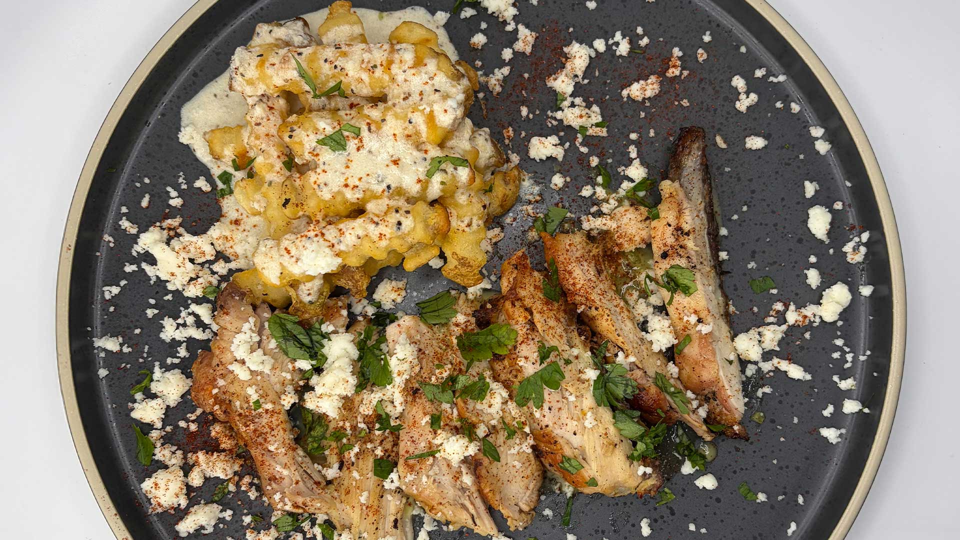 Peruvian-Style Sous Vide Chicken Thighs with Aji Verde and Crispy Yuca Fries